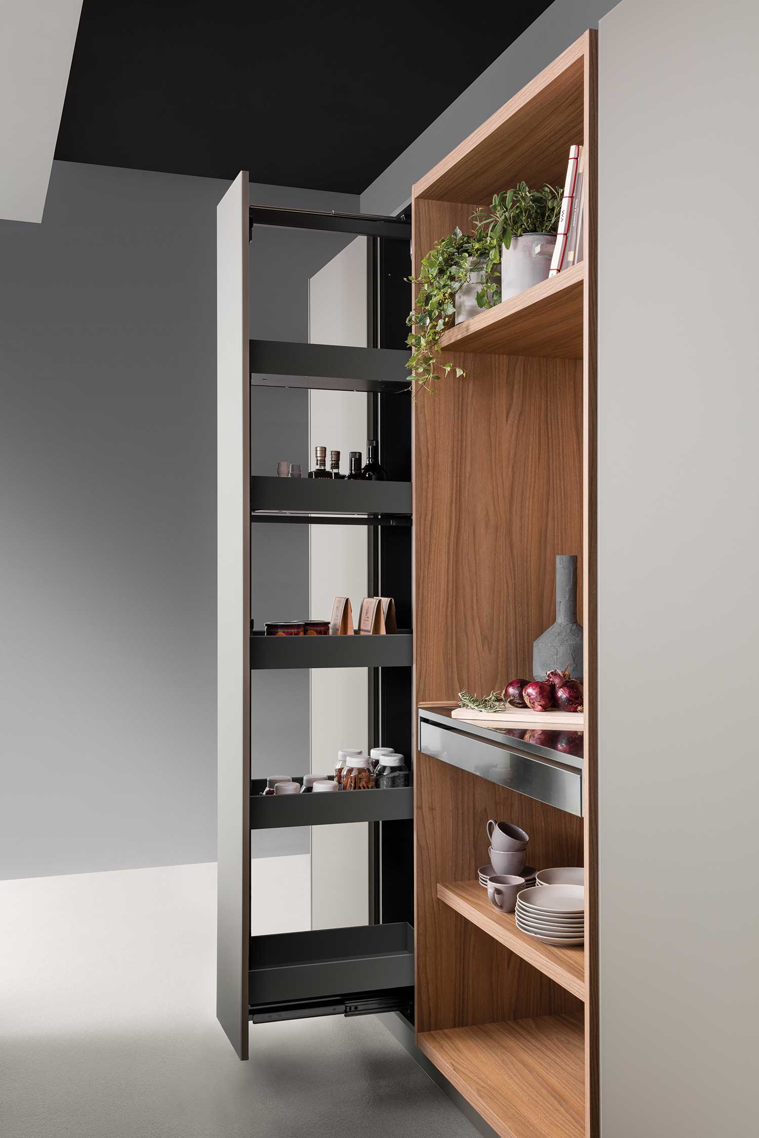 Pull-out tall unit mechanism provides easy and usable storage pantry with non-slip tray bottoms.