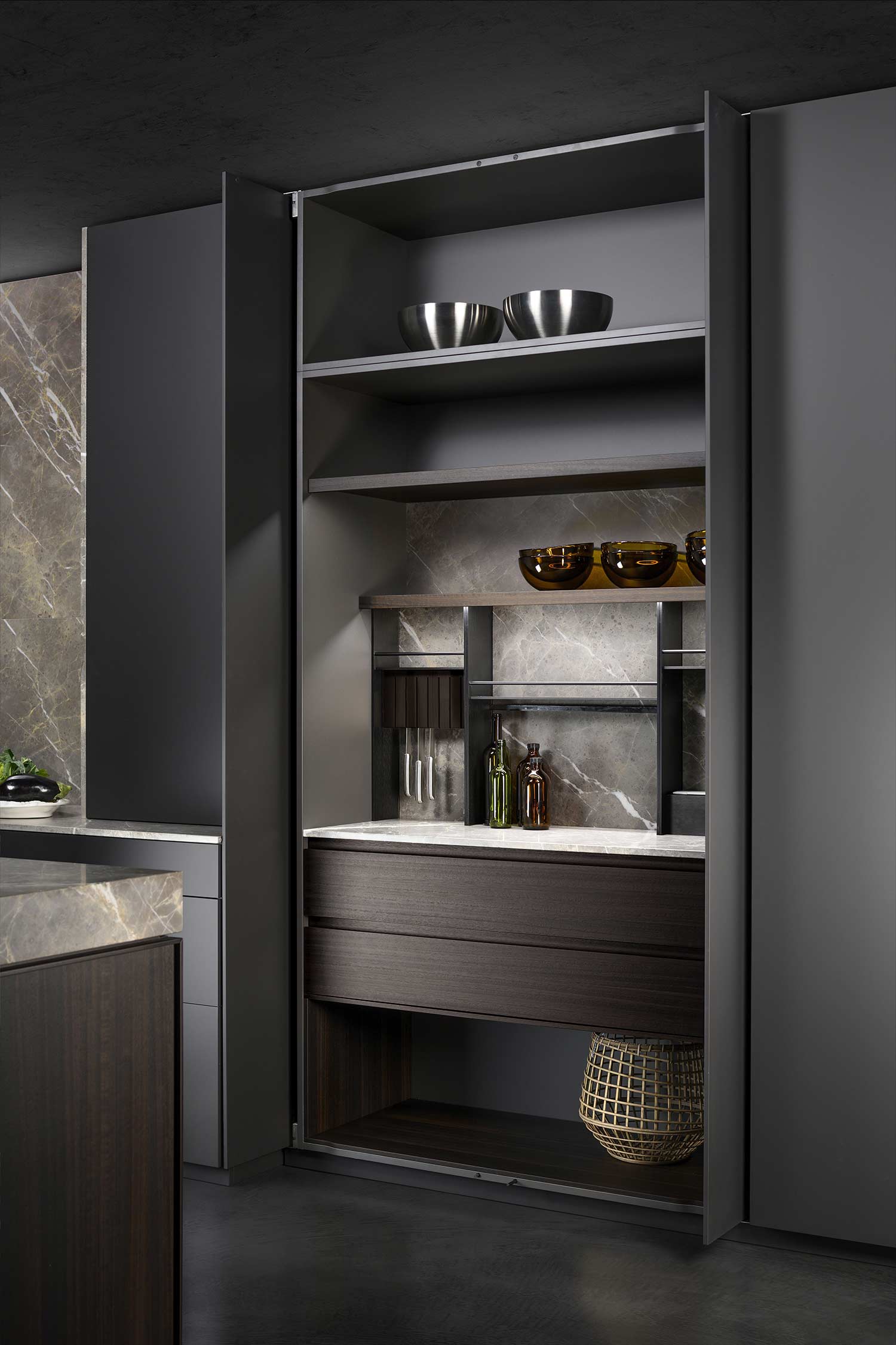 Concealed kitchen unit hidden within soft touch tall unit.