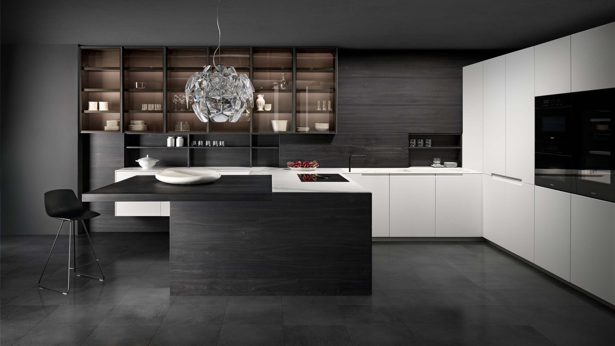 Luxury white modern kitchen with Carrara marble and dark stained oak.